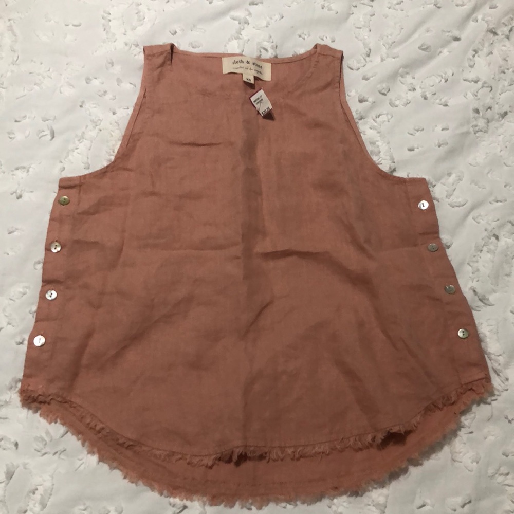 A pinkish peach sleeveless top